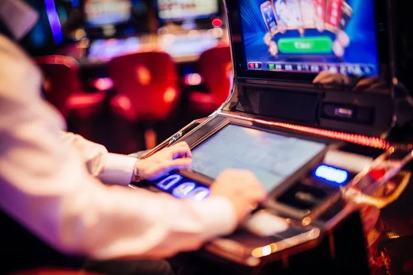 A young woman relaxing with her phone while dynamic casino elements float around her, illustrating the smooth mobile experience offered by the 5XGAME app.